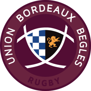Logo: maroon circular badge with shield, blue checkered left half and orange lion on black right half, surrounding text includes 'RUGBY'.